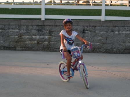 Kasen riding her bike